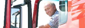 
A driver looking out of the cabin of his truck